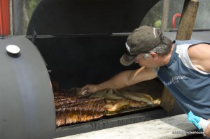Tending the "pit" at my annual Texas BBQ, Fisher River, Montana